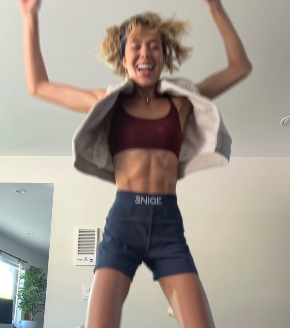 Person mid jumping-jack, tracked by the deFITnitive camera